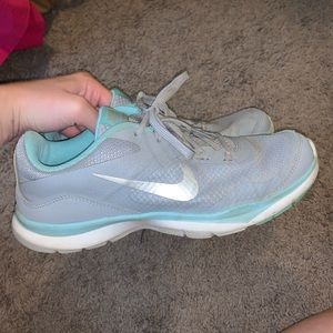 Blue and silver Nike running shoes